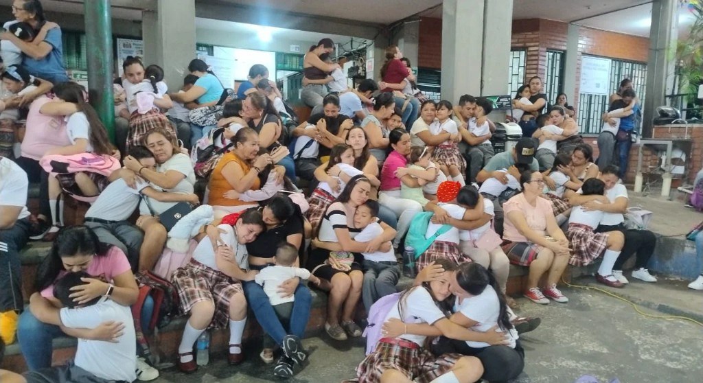 Families embracing during a resilience workshop
